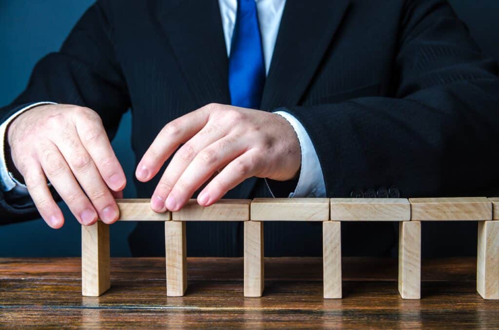 Businessman playing with blocks - Do you truly know how to run a successful SEM campaign? Don't fall down the many pitfalls that can drain your money and time into campaigns that don't convert. This insightful post delves into strategies that will keep your campaigns relevant and converting. - What are the common mistakes to avoid in search engine marketing campaigns? - your wp guy 