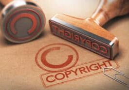 3D illustration of two rubber stamps with copyright word and symbol over kraft paper background, Concept of copyrighted material