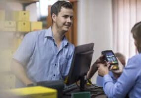 Customer using credit card reader at store